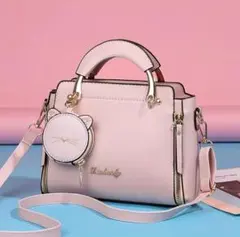 【新品】レディースのピンク色ハンドバッグ ショルダーストラップと猫の小物入れ付き