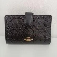 オープン価格】COACH シグネチャーエンボス加工 二つ折り財布 - メルカリ