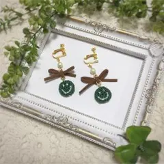ニコちゃんマークとリボンのイヤリング