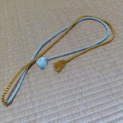 金色と銀色の帯締め 房付き