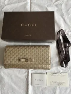 GUCCI マイクログッチシマ リボン 二つ折り長財布 ゴールド - メルカリ