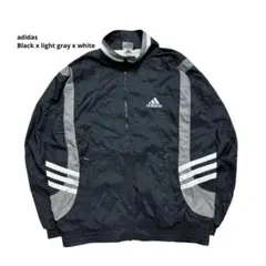 アディダス ナイロンジャケット 90s 万国旗タグ 刺繍ロゴ 黒×白×グレー M