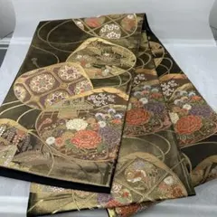 【本金箔全通箔織 玉寶貝花 蜀甲華文】伝統的な金色と黒色の袋帯1224