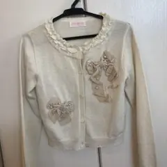 メゾピアノリボン装飾のクリーム色カーディガン