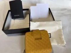 GUCCI グッチ 二つ折り財布 マイクロGG レザー イエローのサムネイル