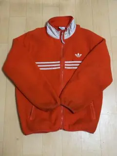 アディダス フリースジャケット オレンジ