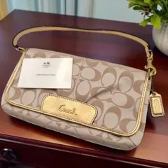 COACH コーチ アクセサリーポーチ リストレット シグネチャー ゴールド