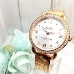 稼働品 美品 コーチ バングル腕時計 レディース ストーン付き 馬車ロゴ