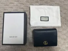 GUCCIのブラック二つ折り財布 GGロゴ付き