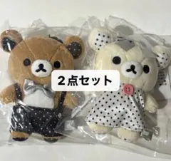 ドット柄の衣装を身にまとった、天使の羽付きリラックマとコリラックマ