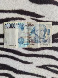 イタリア旧通貨10,000リラ札と1,000リラ札と当時のテレカ。のサムネイル