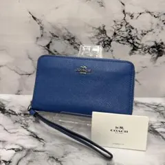 COACH シグネチャー ライトブルーラウンドファスナー長財布 - メルカリ