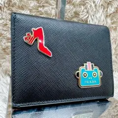 PRADA 二つ折り財布 ロボットモチーフ 希少）PRADA 二つ折り財布 ロボットモチーフ - メルカリ