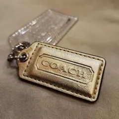 【良品】COACH　コート　チャーム　2点セット　ゴールド　クリア　ラメ