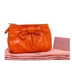 MIUMIUリボンクラッチバッグポーチオレンジ新品Ｒ133ポシェット