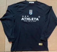 ATHLETA 長袖シャツ カフェ・ド・ブラジル 黒・ゴールド - メルカリ