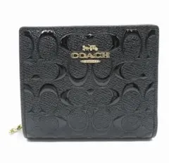 オープン価格】COACH シグネチャーエンボス加工 二つ折り財布 - メルカリ