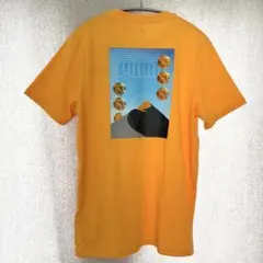 タグ付新品✦PUMA グラフィックTシャツ メンズM オレンジ 男女兼用のサムネイル