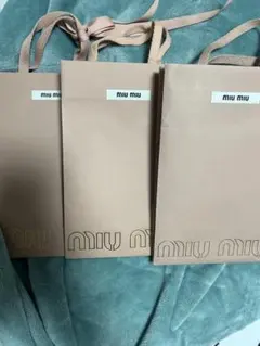 THE ROW 紙袋 5枚　miumiu 紙袋6枚 ハンガー2本レシート入り4枚 MIU MIU（ショップ袋）のフリマアイテム一覧