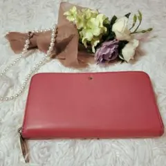 【美品】kate spade NEW YORKラウンドジップサフィアーノ革ピンク