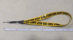 Motif. CAUTION KEEP SMILE ネックストラップ