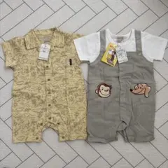 Petit main おさるのジョージロンパース クリーム色の恐竜ロンパース