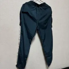 ダークグリーン ピステパンツ サイドストライプ