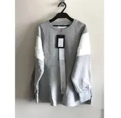 【新品】TRANOI. ペプラムフリル スウェット グレー 綿100%のサムネイル