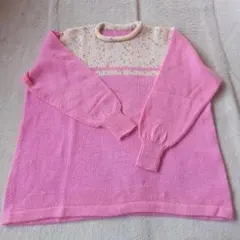 手編みのピンクの長袖ニットセーター