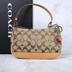 COACH シグネチャー ハンドバッグ ハートチャーム付 ベージュ ポーチ