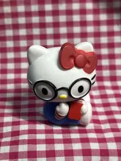 ハローキティ メガネ 本を持つフィギュア - メルカリ