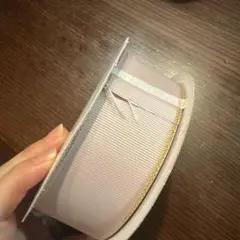 薄いピンクの金縁リボン