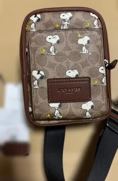 COACH X PEANUTS　レーサー スリングパックシグネチャー キャンバス