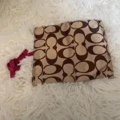 COACH ロゴプリントポーチ ピンク