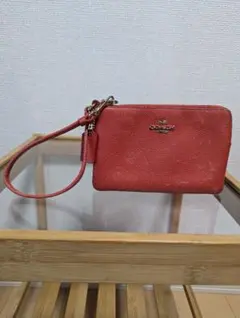 COACH オレンジ レザー ポーチ F58218