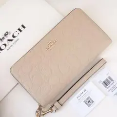 COACH コーチ　長財布　シグネチャー　オートベージュ　ストラップ付きのサムネイル