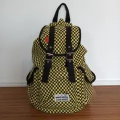 チェッカーパターンリュック MORE HASTE LESS SPEED