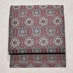 【H66】 くすみピンクX青銅色 象徴柄 名古屋帯