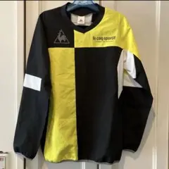 美品 coq sportif メンズテニスサッカーウェアー 黄色 黒MTシャツのサムネイル