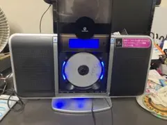 コイズミKOIZUMI CDプレーヤーFMラジオ＆リモコン付壁掛けインテリア時計のサムネイル