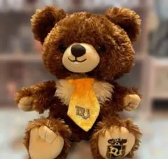 クマのぬいぐるみ オレンジのネクタイ付き