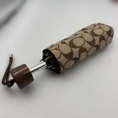 ④coach折りたたみ傘 ブラウンとベージュのロゴデザイン