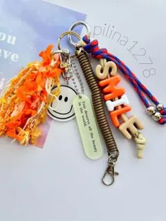 じゃらじゃらキーホルダー スマイル バッグチャーム 韓国風 引き揃え糸 タッセル