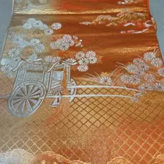 オレンジ系 袋帯 花と車輪の模様 色鮮やか