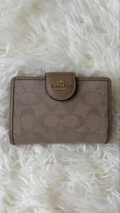 COACH 二つ折り財布 シグネチャー ベージュのサムネイル