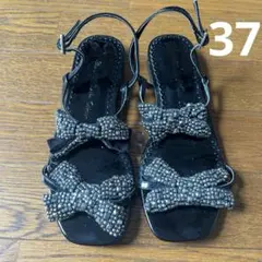 ツルバイマリコオイカワ　リボンビジュフラットサンダル　ブラック　３７のサムネイル