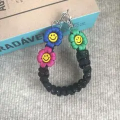 パラコード　ハンドスマホストラップ　☺︎ニコちゃん☺︎ お花　ハンドメイド
