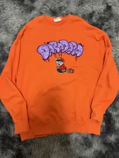 オレンジ グラフィティプリント トレーナー