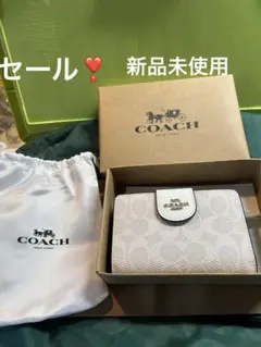 セール❣️COACH 二つ折り財布 ホワイト シグネチャー - メルカリ