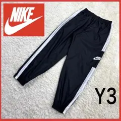 送料無料！ ナイキ モノトーン サイドロゴ ゆるたぼ ナイロン パンツ 長ズボン